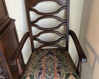One of two Captain’s chairs to formal dining table