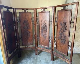 Heavy folding Oriental divider in master bedroom