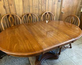 Kitchen table with two leaves and four chairs.  Table protector included.