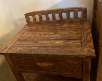 One side table that matches dresser in master bedroom