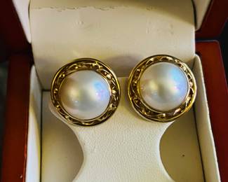 14k omega pearl earrings.