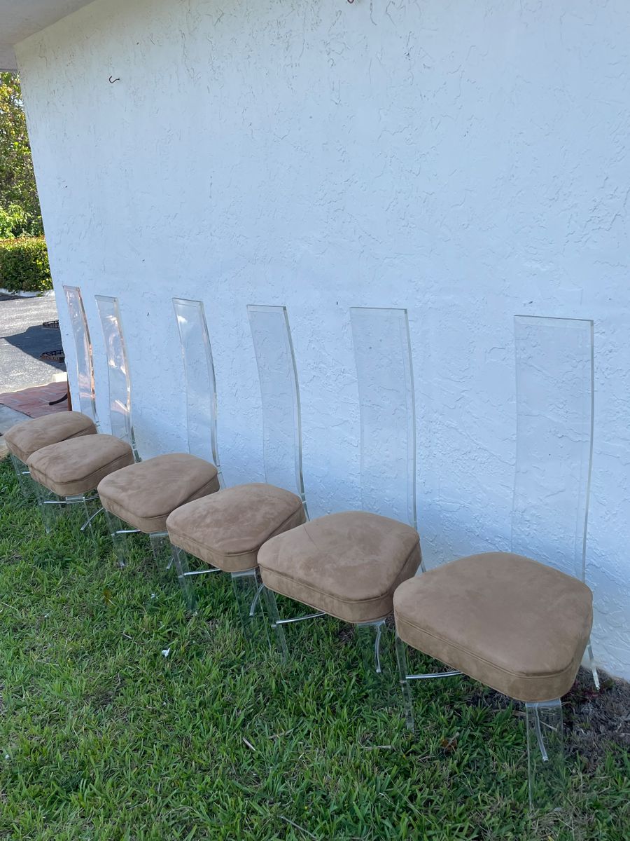 Lucite dining chairs. 