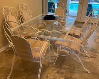 $350 was $500 Iron white table glass top rectangular 42W x 63L with 2 arm chairs and 4 regular chairs 40H x 22W