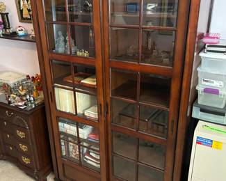 Stunning glass sliding door cabinet in like new condition