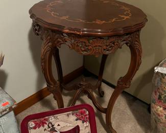 Antique hand carved table with wood inlay