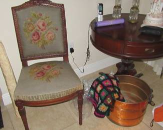 needlepoint chair copper pot rolls of fabric