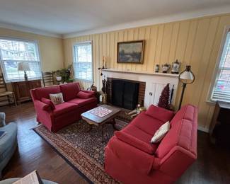 Lovely red love seats, area rug