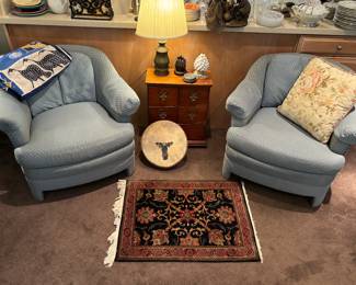 Comfortable blue club chairs, rug