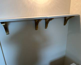 Pair of white and gold wall shelves 8" d x 2' l: $60 pr.