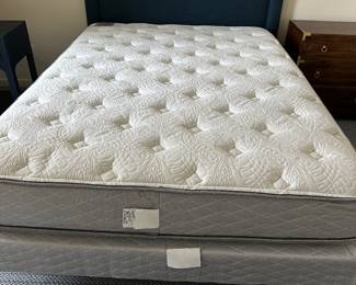 Queen bed with navy upholstered headboard: 62.5" w x 43" t, Waldorf Astoria Perfect Sleeper mattress set in like-new condition. $650