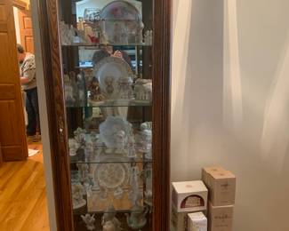 Lighted display cupboard with glass shelves