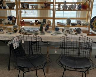 A nice pair of Knoll Bertoia chairs with black padded cushions