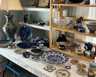 dozens of hand decorated ceramics from Italy, Mexico, Denmark and the United States