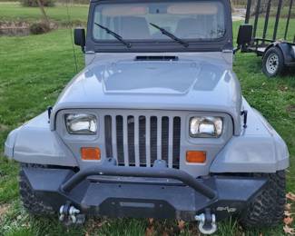 1995 Jeep with small block Chevy motor, has moderate build. Double pumper Edelbrock high rise manifold