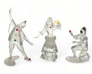 Swarovski (Austrian) 'Masquerade' Crystal Figurines, 'Harlequin', 'Columbine' & 'Pierrot', H 6.5" W 4.25" Depth 2.75" 8 pcs | the collection includes one 'Harlequin' figurine (H 5.25" X W 2" X D 3.75"), one 'SCS Annual Edition 2001 - Harlequin' crystal plaque, one 'Columbine' figurine (H 6.5" X W 4.25" X D 2.75"), one 'Pierrot' figurine (H 7.5" X W 4.25" X D 3.5"), one 'SCS Annual Edition 1999 - Pierrot' crystal plaque, and three presentation stands. Each accompanied with original boxes, measuring H 5.5" X W 6.25" X D 10" overall. Provenance: Property from a Brighton, MI private collection. 