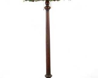 American Leaded Art Glass Floor Lamp, 20th C., "Peach Blossom", H 70" Dia. 25" | Leaded art glass shade having a caramel field, green border with peaches and peach blossoms. Atop a turned wood base. Provenance: Property from the Estate of David Walicki, East Tawas, MI