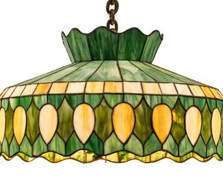 American Leaded Art Glass Hanging Lamp, Ca. Mid 20th C., H 12" Dia. 21" | Green ground with a caramel band. Alternating caramel and green medallions at the outer edge. Wired with four light sockets. Provenance: Property of Prominent Collector, Birmingham, Michigan