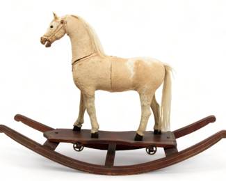 Antique Children's Rocking Horse, Ca. 1850, H 35" W 16" L 50" | the rocking horse offers horse haircoat and horse mane. the horse was once stationed to a platform with wheels, then mounted to rocking horse frame. Circa 1850. Provenance: Property from a private collector of Bloomfield Hills, Michigan.