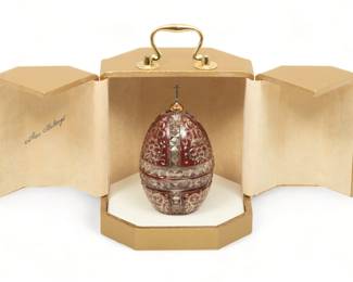 Theo Faberge Crystal And Sterling St Vladimir Egg Ca. 1988, H 5.5" | #169/500. burgundy enamel. Vermeil dome with sterling silver Russian Orthodox cross. Egg opens to show a sterling silver scale of St. Vladimir's Cathedral in Kiev. Inscribed "One thousand years of Russia 988 - 1988". Signed on crystal base.