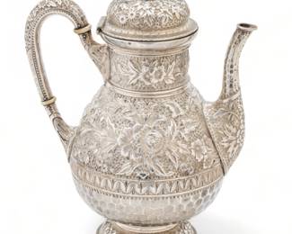 R.A. Durgin (American) Sterling Silver Covered Coffeepot, Chased Design, H 10.5" W 5.25" L 8.5" 36.65t oz | the coffeepot offers a chased design of flower forms and gadrooning. Bearing signature branding and hallmarks to the underside, with 'Elliott' engraved to the foot. Total weight: 36.65 troy ounces. Provenance: Property of a Grosse Pointe Park, MI private collector.