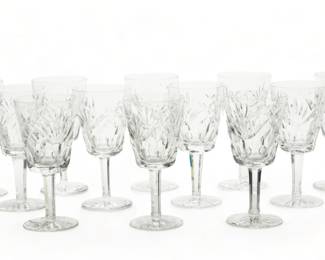 Waterford (Irish) 'Ashling' Cut Crystal Water Goblets, H 6.75" Dia. 3.25" 12 pcs | the goblets offer repetitious fan cuts with fluted bowls on a faceted stem. Each bearing signature branding acid etched to the undersides. Provenance: Property from a Grosse Pointe Farms, Michigan private collector.