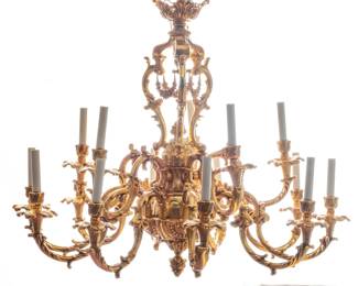 French Rococo Style Dore Bronze 15-Light Chandelier, H 34" Dia. 34" | the chandelier boasts ornate scrolling forms, acanthus leaves, and floral swags. Offers five candlestick arms to the top tier and ten candlestick arms to the lower tier. Electrified. Provenance: Property of a Birmingham, MI private collector. 