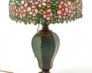 Handel Lamp Company (American, 1885-1936) Leaded Glass Table Lamp on Rare Base "Pink Dogwood", H 17.75" Dia. 12" | Shade signed with Handel two star mark. Base having Handel cloth tag on base felt. Patinated bronze base with green panels, three arms and a pull chain. Wiring appears to be original. Base only: H 14", Dia. 12". Leaded art glass shade in a pink dogwood design, H 6.75", Dia. 12". Provenance: Property from the Estate of David Walicki, East Tawas, MI