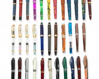 Fountain Pens & Ballpoint Pens, Feat. Parker & Narwhal, H 5" W 12.25" Depth 8.25" 34 pcs | the collection includes one Pelikan fountain pen with 18k gold nib (L 5.75"), two Parker fountain pens with 18k gold nibs, one unmarked fountain pen, three Narwhal fountain pens, two Knox fountain pens, three Birmingham fountain pens, one Sailor fountain pen with 21k gold nib, four 3008 fountain pens, three Wing Sung fountain pens, one Adagio Stipula fountain pen, one TWSBI fountain pen, two Cross ballpoint pens, three Jinhao fountain pens with 18k gold nibs, two Bulow fountain pens, and five Noodlers Ink fountain pens.