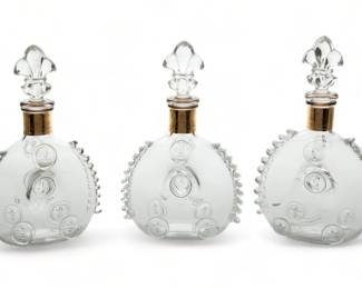 Baccarat (French) Remy Martin Louis XIII Grande Champagne Cognac Crystal Decanters, H 11" 3 pcs | Three Baccarat crystal decanters from Remy Martin Louis XIII cognac. Two having the original storage boxes, one without. Provenance: From the collection of Susan Moran, Royal Oak, MI. 