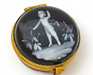 Mary Gregory White Enamel on Black Round Hinged Box Ca. 1870, Dia. 1.7" | Miniature enamel of child in landscape. Hand decorated. Provenance: From the Estate of Prominent Collector, Leon Zielinski, Macomb County, MI