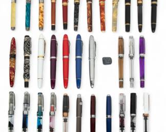 Fountain Pens, Feat. Montegrappa, Visconti & Mont Blanc, H 5" W 12" Depth 8.25" 33 pcs | the collection includes three Montegrappa fountain pens (L 5.25"), two Visconti fountain pens with 18k gold nibs, one Visctoni 'Medici' fountain pen with 23k gold nib (L 5.75"), one Aurora fountain pen with 14k gold nib, one Namiki fountain pen with 18k yellow gold nib, one Pelikan fountain pen with 18k gold nib, one Mont Blanc 'Meisterstuck No. 149' fountain pen with 18k gold nib, one Pilot pen with 14k yellow gold nib, one Waterman fountain pen with 18k nib, one Benu fountain pen, five Jinhao fountain pen with 18k gold nibs, one Bulow fountain pen, three 3013 fountain pens, and eleven TWSBI fountain pens.