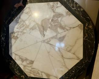 Heavy marble tabletop. Quality piece.