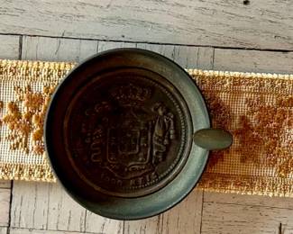 Brass Ash tray mounted on fabric ribbon to hang  over the arm of a chair or sofa. 