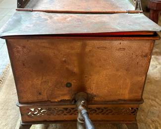 Possibly an antique copper tea box.