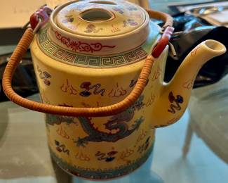 Chinese porcelain teapot with wrapped bamboo handle. Circa 1940’s
