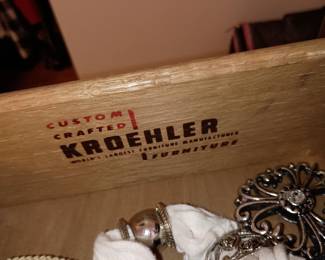 These are small chests located in the sewing room . More traditional looking pieces of furniture 