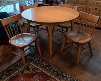 Mid Century influenced table and chairs set
Hard wood maple
With three 12" leaves