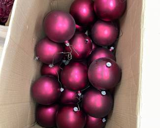 Boxes of giant Christmas ornaments 
