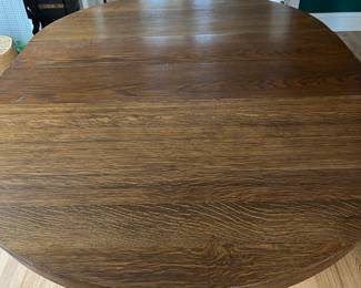 Late 19th century oak pedestal dining table with two leaves, goes from round to oval, solid wood
