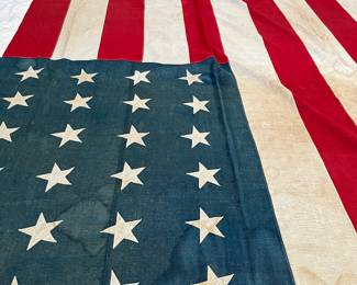 Huge early 48 star American flag, 8’ x 15’, all stitched with appliqué stars, some minor water stains, c 1912-1917, around 1918 federal law stated that all US flags are to be in straight rows and columns and this flag is staggered, linen