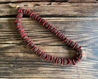 A necklace of Nepalese Rudraksha with red felt, vintage