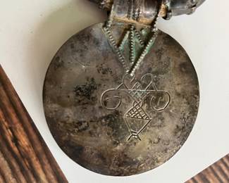 Omani silver pendant on a necklace with large silver beads and two 18th century coins on a thick cord