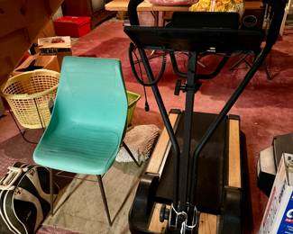 Treadmill and mid century chair