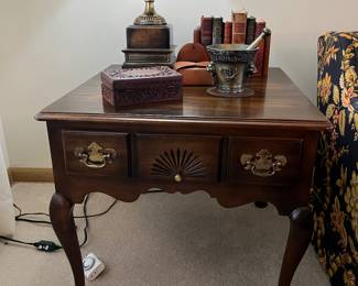 Chippendale style end table with carved shell detail and bat wing brasses