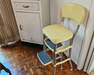 Vintage metal cabinet and retro pull out step stool.