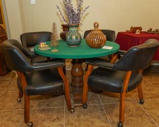 Pedestal table with upholstered rolling chairs
