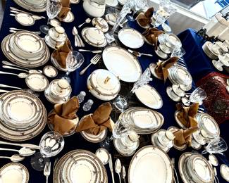 Elegant Haviland  Limoges  Extensive service for 10 .  Each place setting includes: Dinner plate,  Luncheon Plate, Salad plate Bread & Butter plate, Coupe Soup. Bowl, Soup bowl, Fruit/ Berry Bowl, Finger bowl, Cup & saucer, & Demitasse cup & saucer.  multiple serving plates, Vegetable bowls, covered butter dish & multiple butter pat plates, pitcher,  cream & sugar, and additional pieces of place settings.
Sliverplate service for 8 flatware & serving pieces.
Pair of tall heavy crystal candlestick holders.
Boxed set of large serving spoons.
Set of 12 delicate gold rimmed goblets.