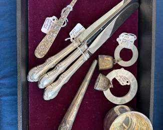 Sterling silver spoon, knife handles , baby items, and antique glove stretcher.