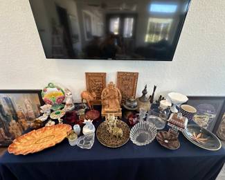 Variety of decor treasures from Cranberry glass to wooden camels and giraffes.  