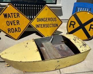 Road signs and Amusement park boat from boat ride